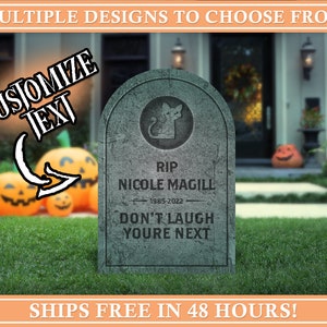 May include: A gray tombstone with a black cat silhouette and the text "RIP NICOLE MAGILL 1985-2022 DON'T LAUGH YOU'RE NEXT". The tombstone is in front of a house with a green lawn and pumpkins.