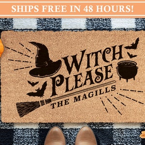 May include: A brown coir doormat with the text "Witch Please The Magills" in black. The doormat features a black witch's hat, a broom, a cauldron, and bats.