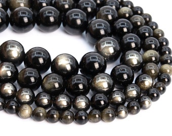 May include: A strand of black obsidian beads with gold flecks. The beads are round and smooth, and they are arranged in a spiral pattern.