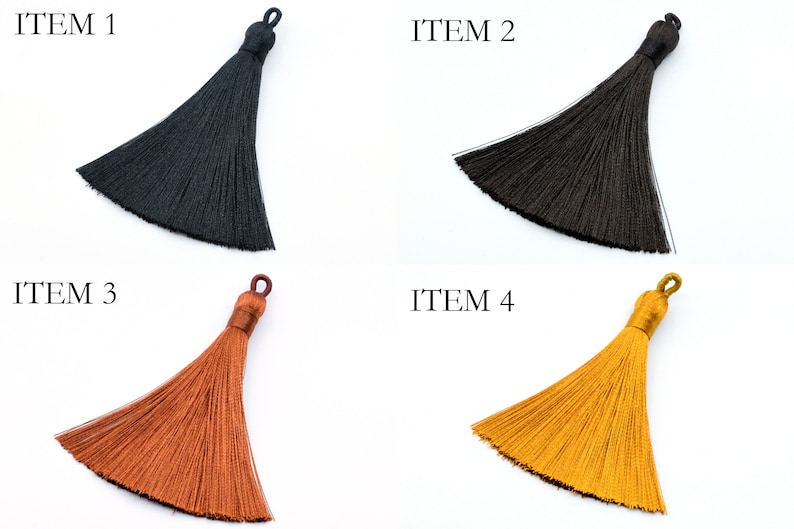 May include: Four different colored tassels, black, brown, orange, and yellow.  ITEM 1, ITEM 2, ITEM 3, and ITEM 4 are labeled above each tassel.