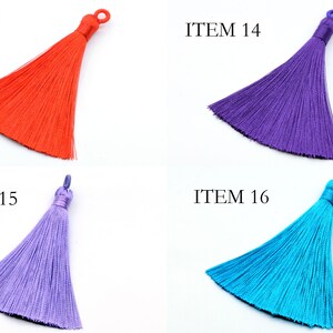 May include: Four different colored tassels, each with a loop at the top. The tassels are red, purple, light purple, and blue. The tassels are labeled with the numbers 13, 14, 15, and 16.