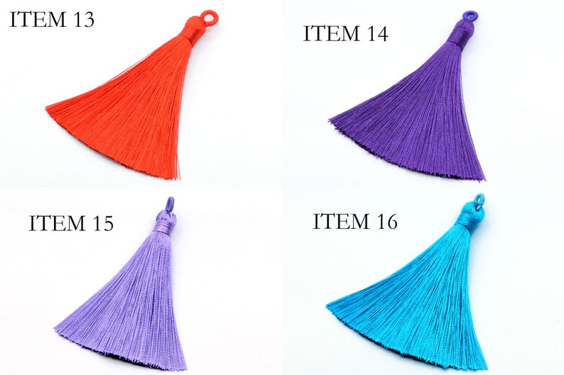 May include: Four different colored tassels, each with a loop at the top. The tassels are red, purple, light purple, and blue. The tassels are labeled with the numbers 13, 14, 15, and 16.