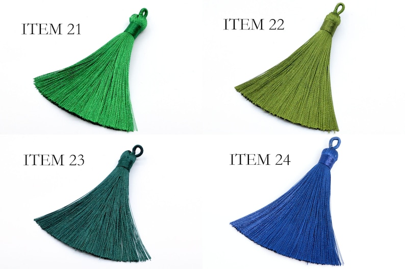 May include: Four different colored tassels, labeled ITEM 21, ITEM 22, ITEM 23, and ITEM 24. The tassels are green, olive green, dark green, and blue.