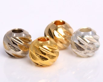 20 cuentas espaciadoras redondas de 6 mm en tonos dorados y plateados antiguos.