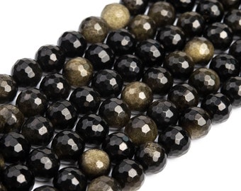 May include: A strand of black and gold gemstone beads. The beads are faceted and have a round shape.
