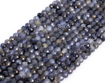 May include: A strand of faceted blue and gray gemstone beads. The beads are round and have a slightly irregular shape.