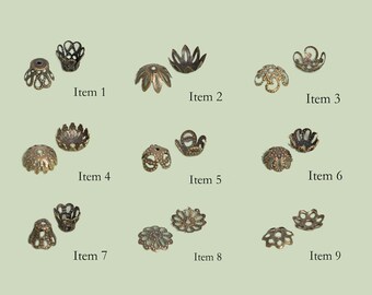 May include: Nine different styles of metal bead caps in gold tone. Each cap has a different design with intricate details. The caps are perfect for adding a touch of elegance to jewelry projects.