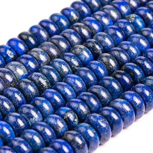 May include: A strand of deep blue lapis lazuli beads with gold flecks. The beads are round and have a smooth, polished finish.