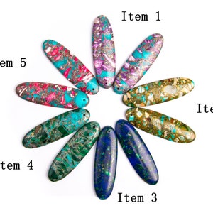 May include: Assortment of eight oval-shaped, colorful, and patterned stones. The stones are arranged in a circle with the points facing outwards. The stones are labeled "Item 1" through "Item 5".