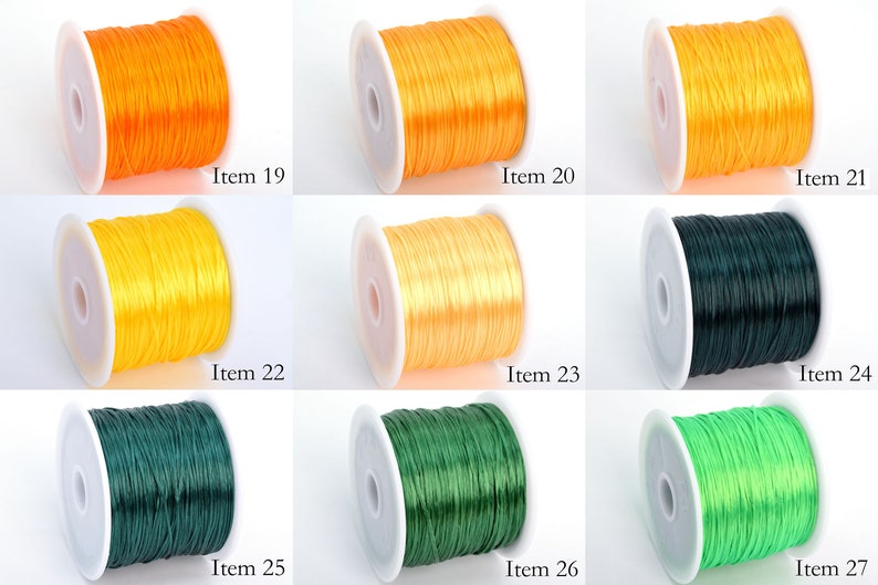 May include: Nine spools of elastic cord in various colors, including orange, yellow, green, and lime green. Each spool is labeled with an item number from 19 to 27.