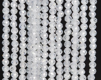 May include: A strand of clear faceted glass beads. The beads are round and have a shiny finish.