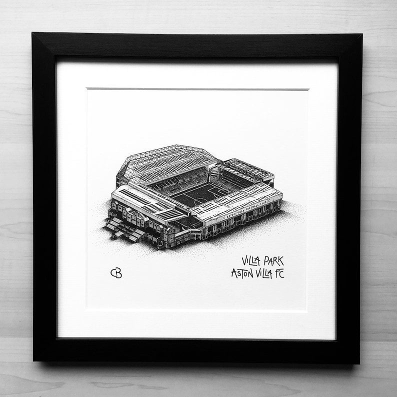 May include: A black and white line drawing of Villa Park, the home stadium of Aston Villa Football Club. The drawing shows the stadium from an aerial perspective, with the pitch and stands visible. The text "Villa Park Aston Villa FC" is written below the drawing.