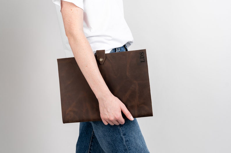 This Leather portfolio can be carried around easily. It's a soft leather and carry your notepad, business cards and more