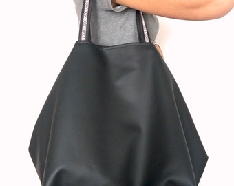 Vegan black bag with turquoise interior. Vegan leather tote bags and native style handles