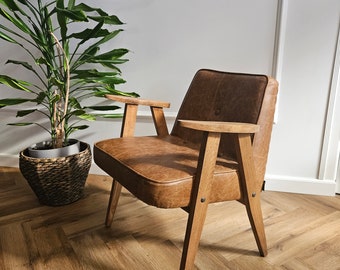Original 366 chair from 1960s covered in genuine Italian leather. Designed by J. Chierowski