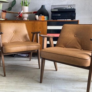 Original 366 chair from 1960s covered in genuine Italian leather. Designed by J. Chierowski