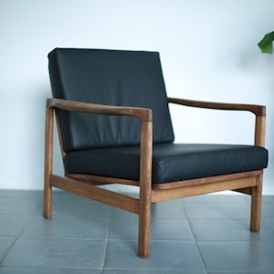 Vintage polish wooden club armchair from Mid Century in genuine Italian black leather