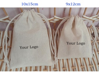 May include: Two beige drawstring bags, one 10x15cm and the other 9x12cm, are displayed. Each bag has a white drawstring closure and the text "Your Logo" printed on the front. The bags are made of a natural fabric.