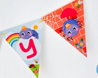 May include: A colorful alphabet banner with a letter Y, a rainbow, a ladybug, and a bee. The letter Y is on a blue background with a spider holding a sun. The other flags have a spider holding an umbrella, a bee, and a brick wall.