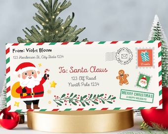 May include: Christmas-themed envelope addressed to Santa Claus, featuring a cartoon Santa illustration, stamps, and festive greetings. The envelope has a red, green, and white striped border and includes the sender's address.