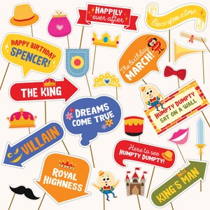 May include: A set of 15 colorful photo booth props featuring a fairytale theme. The props include a crown, a purse, a king's sign, a villain sign, a speech bubble that says "Dreams Come True", a speech bubble that says "Royal Highness", a speech bubble that says "Here to see Humpty Dumpty", a speech bubble that says "King's Man", a speech bubble that says "Humpty Dumpty Sat on a Wall", a speech bubble that says "The Birthday March", a speech bubble that says "Happily Ever After", a speech bubble that says "Once Upon a Time", a trumpet, a bow tie, a mustache, and a sword.