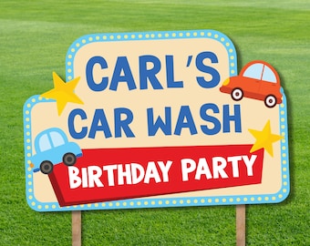 May include: A blue and red sign with yellow stars and cartoon cars. The sign says "Carl's Car Wash Birthday Party".