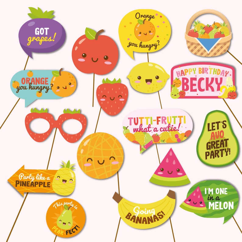 May include: A set of 14 colorful fruit-themed photo booth props. The props include a pineapple, watermelon, avocado, pear, lemon, orange, strawberry, apple, grapes, and bananas. The props are perfect for a fruit-themed party or event.