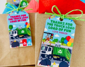 May include: A green and white garbage truck with a monkey, raccoon, and banana on the side. The truck has a tag attached to it that says "Thanks for the truck load load of fun Love Parker".