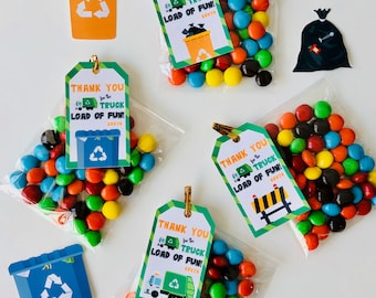 May include: Four small bags of colorful candy with thank you tags attached. The tags are green, orange, and yellow with a cartoon garbage truck and the text "Thank you for the truck load of fun!" with the name Kevin.