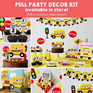 A yellow school bus themed party decor kit with a banner that says "MARCUS" and includes a cake, cupcakes, stop signs, and other decorations.