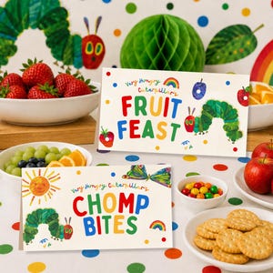 May include: Two rectangular white cards featuring The Very Hungry Caterpillar illustrations. The top card reads Very Hungry Caterpillar's FRUIT FEAST with a caterpillar and fruit graphics. The bottom card reads Very Hungry Caterpillar's CHOMP BITES.