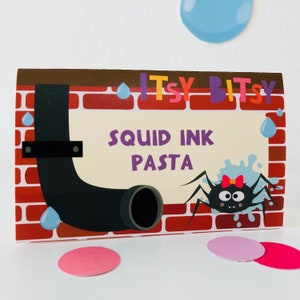 May include: A printable food label with a cartoon illustration of a spider and a pipe. The label says "Itsy Bitsy Squid Ink Pasta".