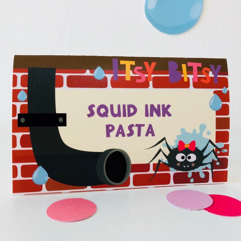 May include: A printable food label with a cartoon illustration of a spider and a pipe. The label says "Itsy Bitsy Squid Ink Pasta".