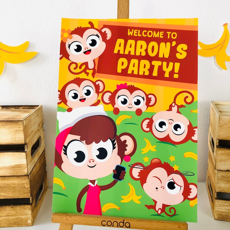 May include: A yellow and orange welcome sign with the text "Welcome to Aaron's Party!" surrounded by cartoon monkeys. The monkeys are brown, white, and pink with big eyes and smiles. There are bananas and stars on the background.