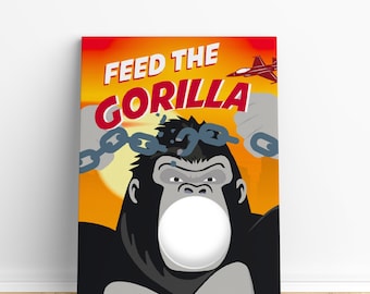 May include: A game board featuring a cartoon gorilla breaking free from chains. The gorilla has a large, white circle for a mouth, where a face can be placed. The text "Feed the Gorilla" is at the top of the board.