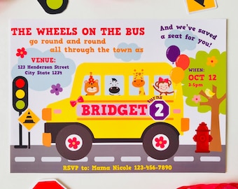 May include: A yellow school bus with a sign that says "BRIDGET turns 2" and a variety of animals on board. The bus is driving on a grey road with a stop sign and a traffic light. The invitation says "The Wheels on the Bus go round and round all through the town as" and includes the date and time of the event.