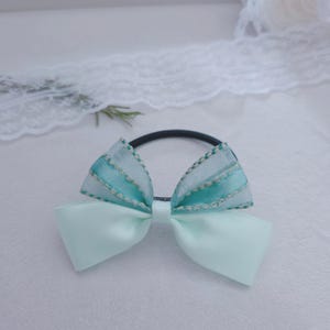 May include: A handmade wooden sign displaying the word "Welcome" in a whimsical font. The sign has a distressed finish and a simple, rustic design, suitable for a front door or hallway. The rectangular sign appears to be crafted from reclaimed wood.