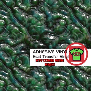 May include: Green and blue heat transfer vinyl with a textured, wrinkled, or crinkled appearance. The vinyl is adhesive and comes with a mask. The text "ADHESIVE VINYL Heat Transfer Vinyl HTV COMES WITH MASK!" is printed on a white rectangle. A red circle with a green t-shirt with the text "HTV GURU" is in the corner of the image.