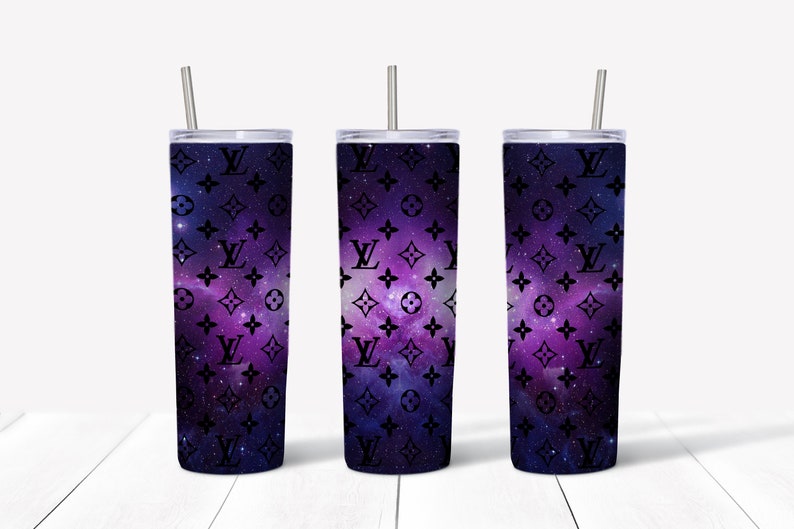 May include: Three stainless steel tumblers with lids and straws. The tumblers are wrapped with a galaxy print featuring a black and white Louis Vuitton pattern.