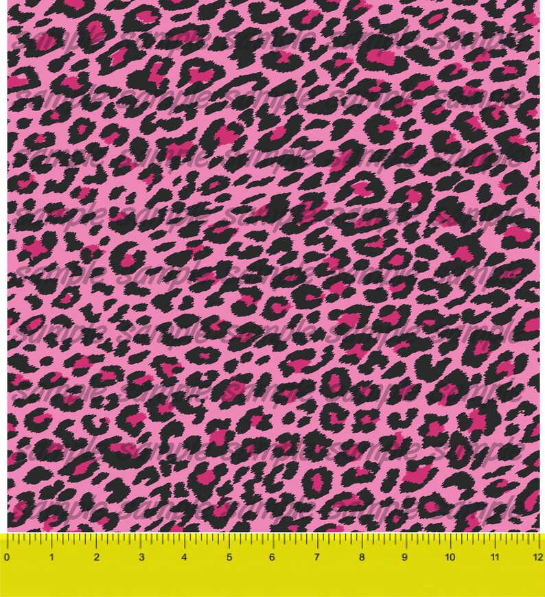 May include: Pink and black leopard print fabric with a repeating pattern. The fabric is measured in inches.