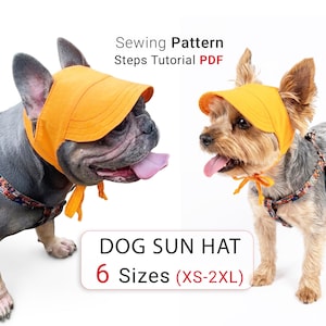 Op de afbeelding: Een feloranje zonnehoed voor honden met een brede rand en kinbandjes. De tekst luidt Sewing Pattern Steps Tutorial PDF en DOG SUN HAT 6 Sizes (XS-2XL). De hoed wordt gedragen door een Franse Bulldog en een Yorkshire Terrier met tuigjes.
