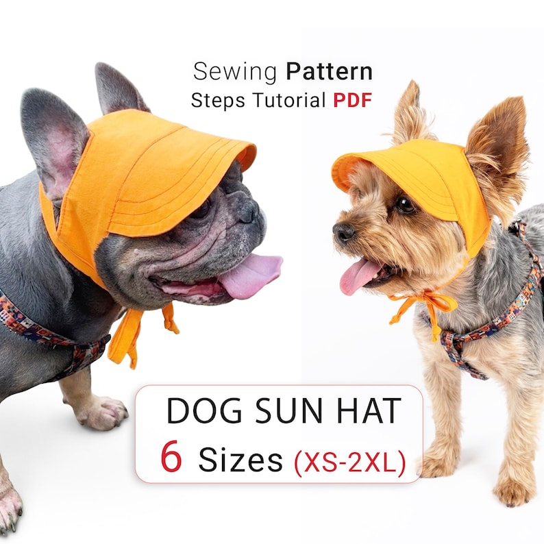 Op de afbeelding: Een feloranje zonnehoed voor honden met een brede rand en kinbandjes. De tekst luidt Sewing Pattern Steps Tutorial PDF en DOG SUN HAT 6 Sizes (XS-2XL). De hoed wordt gedragen door een Franse Bulldog en een Yorkshire Terrier met tuigjes.