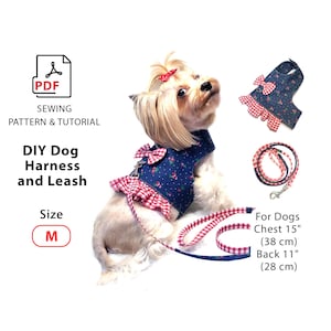 May include: A blue dog harness with a red and white gingham trim and bow, paired with a matching leash. The harness is adorned with a small floral pattern. The text reads "DIY Dog Harness and Leash" and "Size M". Chest 15" (38 cm), Back 11" (28 cm).