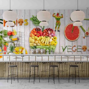 May include: A kitchen scene with a bar and stools, featuring a mural of fruits and vegetables. The mural includes the words "Fruits" and "Vegetables" made of produce. Decorative elements include a bicycle made of grapefruit slices and a weightlifter made of vegetables.