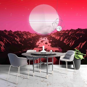 May include: A dining set featuring a round black marble-patterned table and two gray upholstered chairs. The background is a wall mural depicting a red landscape with a large white sun, rocky mountains, and a geometric wire light fixture.
