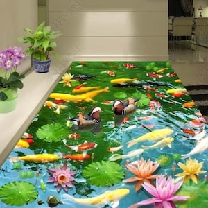 May include: A 3D floor decal featuring a pond scene with colorful koi fish swimming among lily pads and lotus flowers. Two mandarin ducks are swimming in the water.