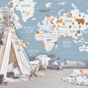 May include: A wall mural featuring a world map with a light blue background, white continents, and various animal illustrations. The map includes labels for oceans and countries. A white fabric teepee stands in front of the wall mural.