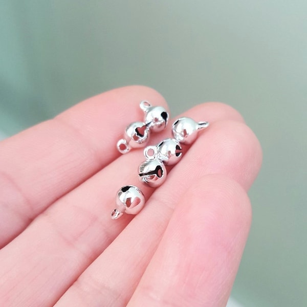 25/50/100 x Tiny Chiming Bohemian Bell Charms, 9mm x 6mm Silver Plated Copper Pieces, by Jewellery Making Supplies London ( JMSLondonCo ).