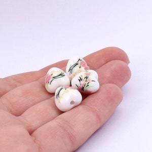 4 x Ceramic Heart Shaped Beads, White Floral Ceramic Heart Beads, 12mm x 11mm, by Jewellery Making Supplies London ( JMSLondonCo )