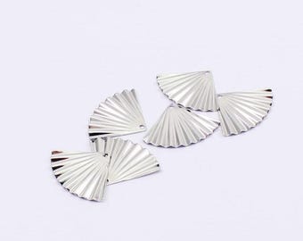 May include: Six silver metal fan-shaped charms with a hole at the top for attaching to jewelry or other crafts.